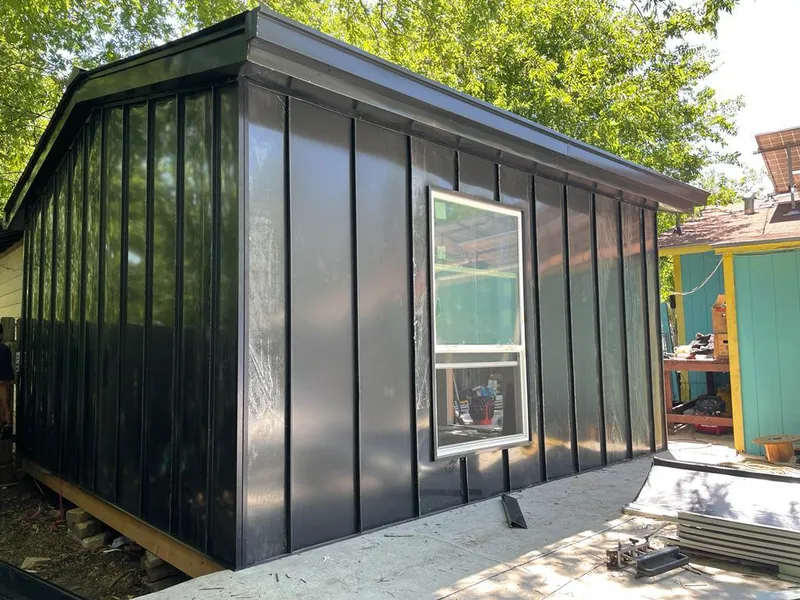 Black standing seam metal wall panels for Roof Inspection in Burnsville