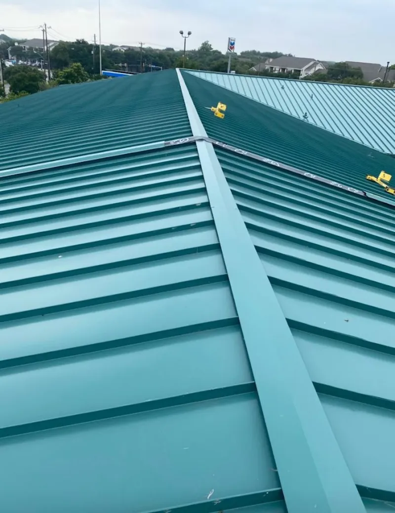 Green commercial metal roof ridge and valley for Metal Roof Repair in Burnsville