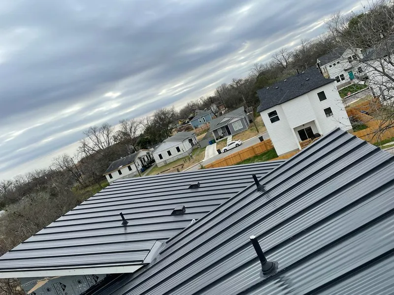 Standing seam metal roof panels with vents for Skylight Repair in Burnsville